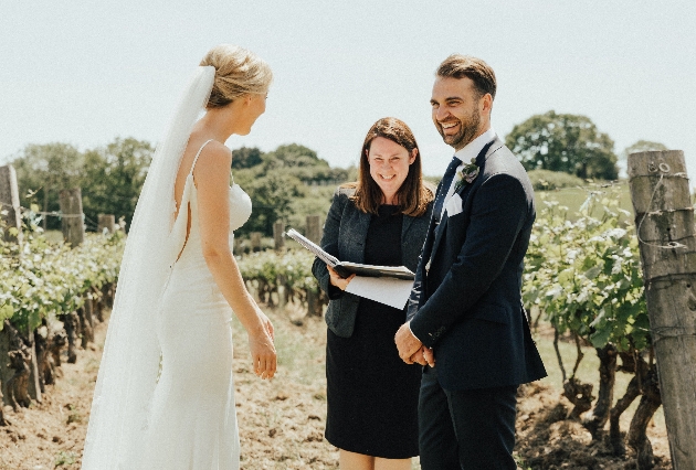 Nichola Collinson officiates a wedding ceremony in a vineyard