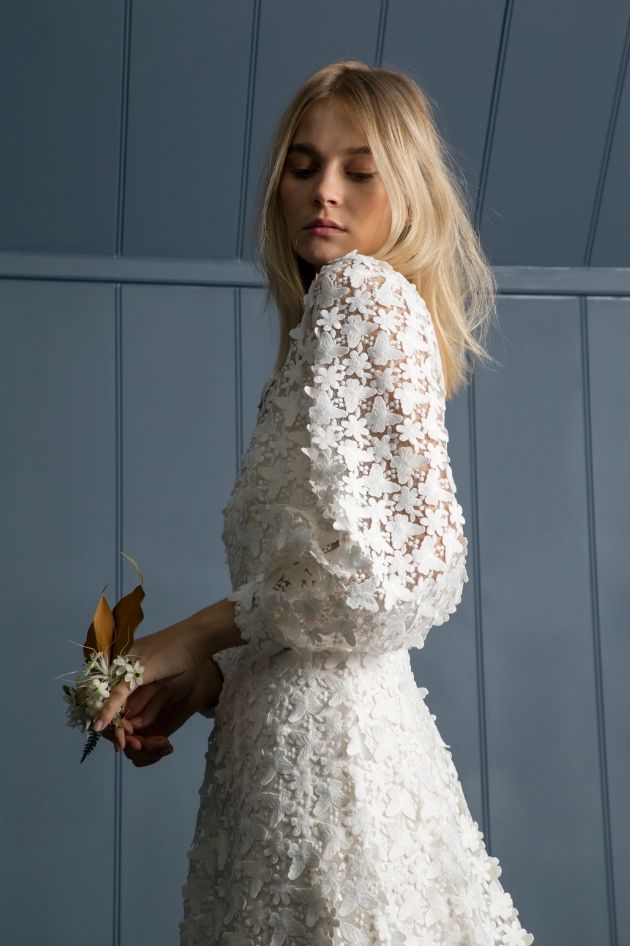 Model wearing applique wedding dress