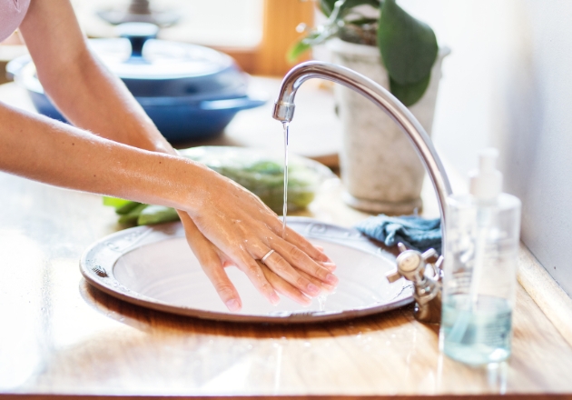 hands washing in a sink