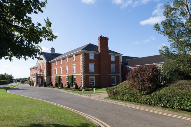 Whittlebury Park front red brick building with drive and surrounded by trees
