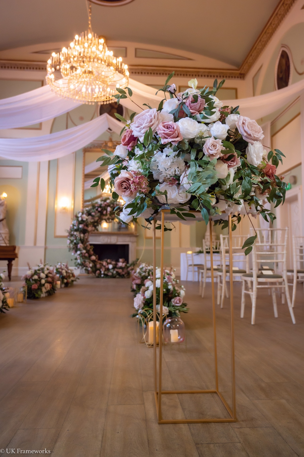 image of various floral displays down a ceremony aisle