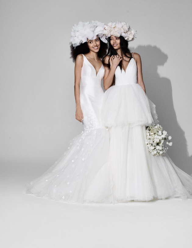 two models in white dresses, one fishtail and one peplum tiered