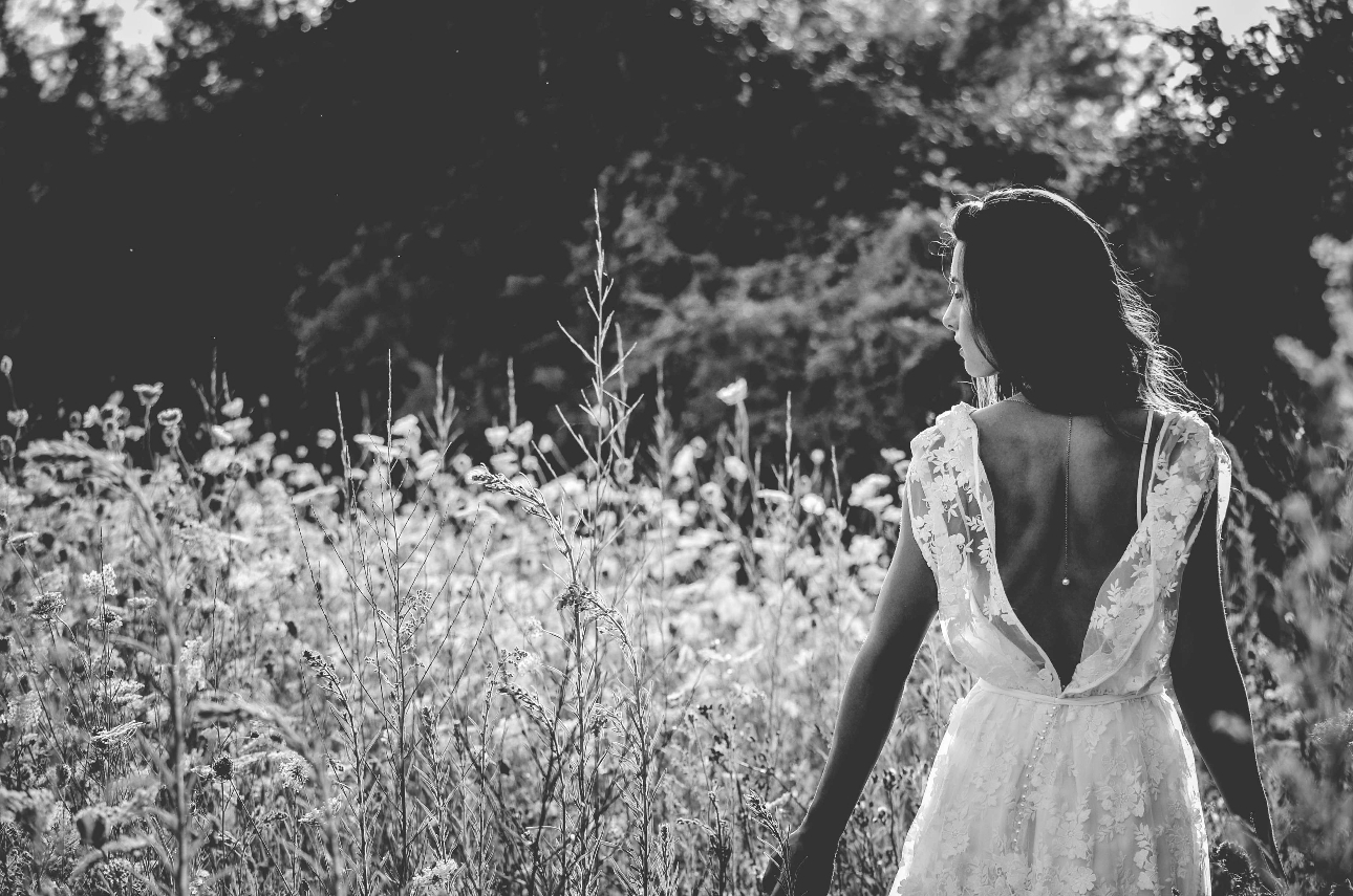 bride walking in field
